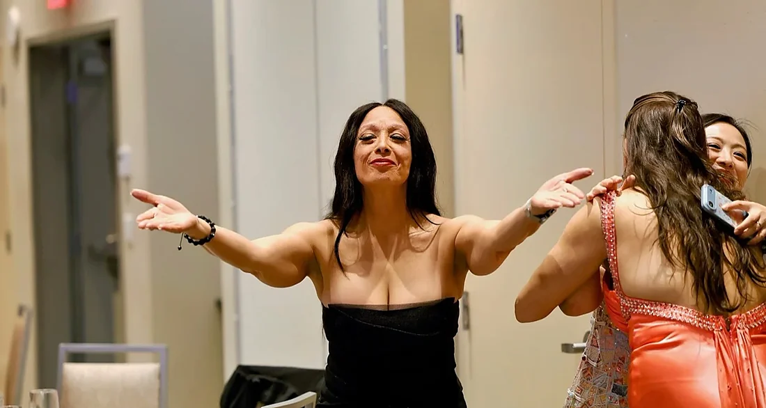 Dhorea Ramanula with arms open at the Kelowna Women in Business RISE Awards